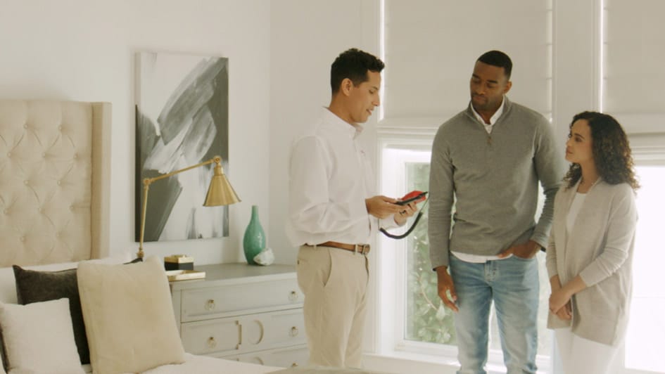 a man and a woman standing in a room
